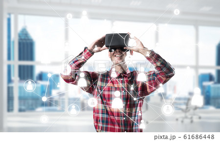 Guy wearing checked shirt and virtual mask demonstrating some emotions Guy wearing checked shirt and virtual mask demonstrating some emotions 61686448