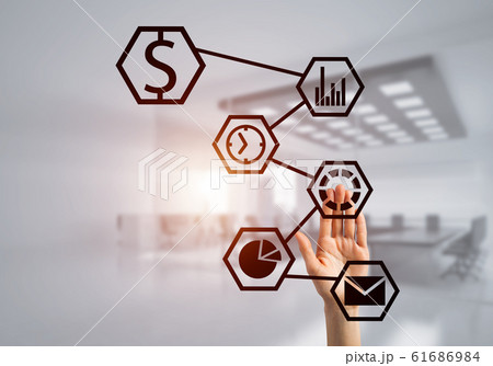 Modern office interior and close of businesswoman hand choosing symbol on application interface Modern office interior and close of businesswoman hand choosing symbol on application interface 61686984
