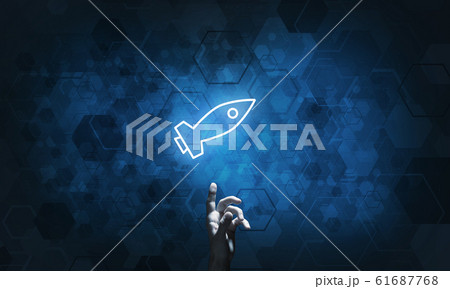 Technology idea concept with glowing rocket icon and touching it finger Technology idea concept with glowing rocket icon and touching it finger 61687768
