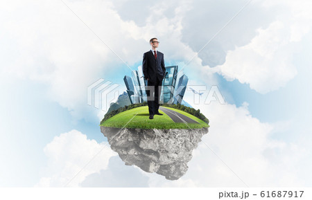 Confident boss and modern city as concept of eco green construction Confident boss and modern city as concept of eco green construction 61687917