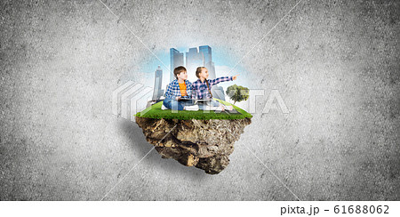 Two kids of school age with book exploring this great world Two kids of school age with book exploring this great world 61688062