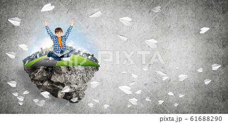 Cute boy of school age with book exploring this great world 61688290