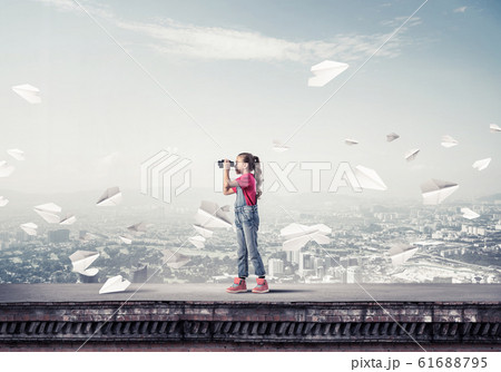 Concept of careless happy childhood with girl of school age look Concept of careless happy childhood with girl of school age look 61688795