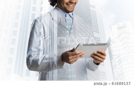 Medical industry concept by means of successful doctor Medical industry concept by means of successful doctor 61689137