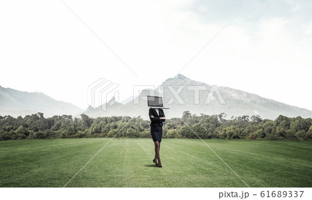 Business woman with laptop instead of head. 61689337