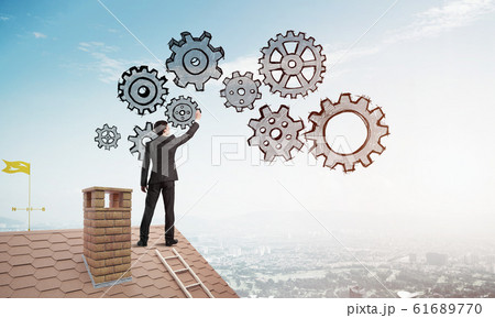 Mister boss on brick roof standing with back and draw teamwork concept. Mixed media Mister boss on brick roof standing with back and draw teamwork concept. Mixed media 61689770