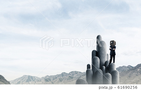Businessman with an old TV instead of head. 61690256