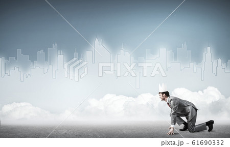 King businessman in elegant suit running and blue cityscape silh 61690332