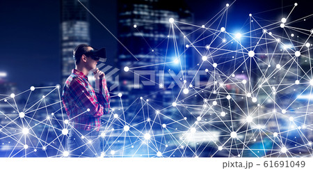 Guy wearing checked shirt and virtual mask holding his hand on chin Guy wearing checked shirt and virtual mask holding his hand on chin 61691049