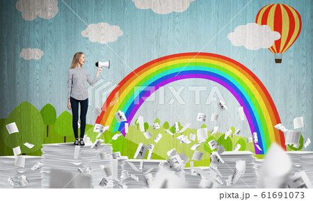 Woman keeping megaphone in hand. Woman keeping megaphone in hand. 61691073