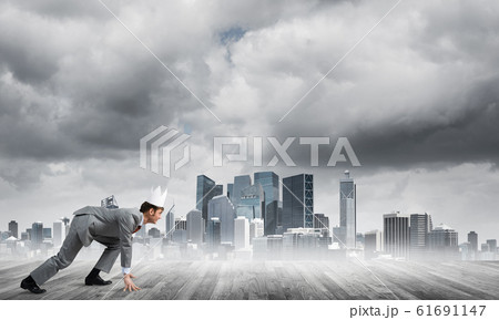 King businessman in elegant suit running and modern cityscape at background King businessman in elegant suit running and modern cityscape at background 61691147