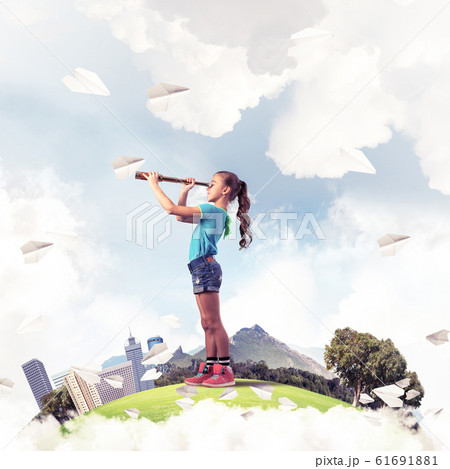 Concept of careless happy childhood with girl looking in future Concept of careless happy childhood with girl looking in future 61691881