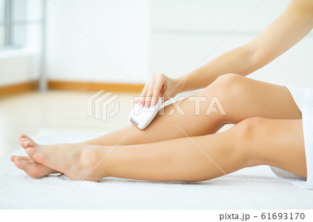Skin Care. Female leg shaving by electric shaver Skin Care. Female leg shaving by electric shaver 61693170