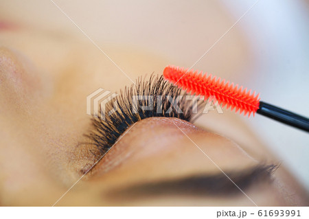 Woman eye with long eyelashes. Mascara Brush. High quality image 61693991