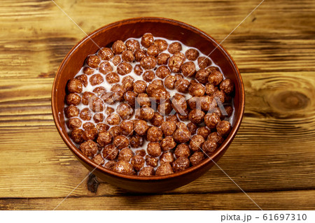 Cereal chocolate balls with milk in a bowl Cereal chocolate balls with milk in a bowl 61697310