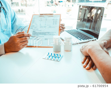 Doctors report health examination results and recommend medication to patients 61700954