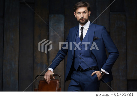 indoor photo of young handsome stylish businessman wearing suit indoor photo of young handsome stylish businessman wearing suit 61701731