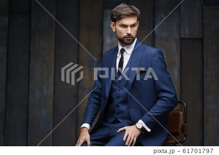 indoor photo of young handsome stylish businessman wearing suit 61701797