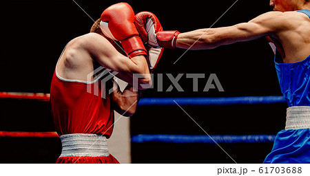 boxer lands left jab to head boxer lands left jab to head 61703688