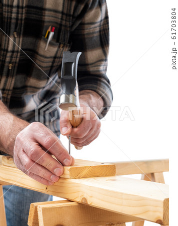 Carpenter at work on wooden boards. Carpentry. Carpenter at work on wooden boards. Carpentry. 61703804