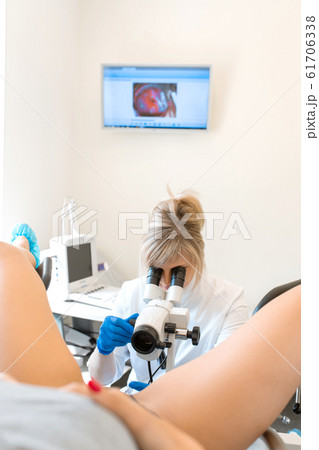 A gynecologist is examined by a patient who is 61706338