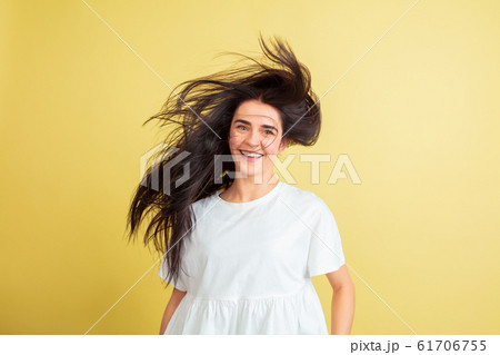 Easter bunny woman with bright emotions on yellow studio background Easter bunny woman with bright emotions on yellow studio background 61706755