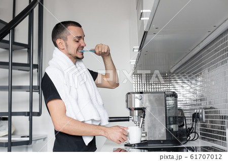 A young guy is going to work in the morning. A young guy is going to work in the morning. 61707012