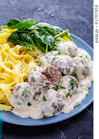 classic Swedish meatballs served with egg noodle 61707956