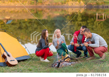 travel, tourism, hike, picnic and people concept - 61708158