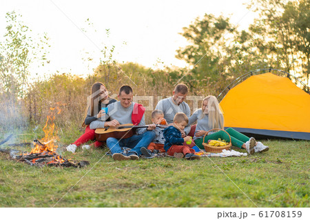 travel, tourism, hike, picnic and people concept - 61708159