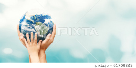 Earth globe in family hands. World environment day Earth globe in family hands. World environment day 61709835