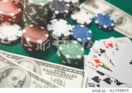 Poker chips, cards on green table 61709859