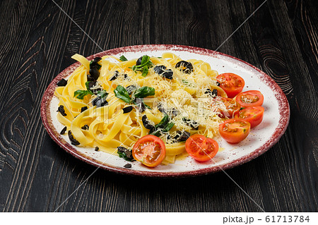 Tagliatelle with tomato, parmesan, chopped olives 61713784