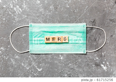 MERS word written on wood block lying on medical MERS word written on wood block lying on medical 61715256