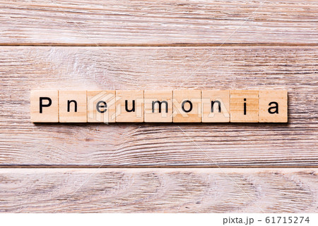 pneumonia word written on wood block. pneumonia pneumonia word written on wood block. pneumonia 61715274