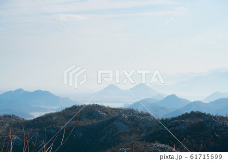 mountains range in the haze in Montenegro mountains range in the haze in Montenegro 61715699