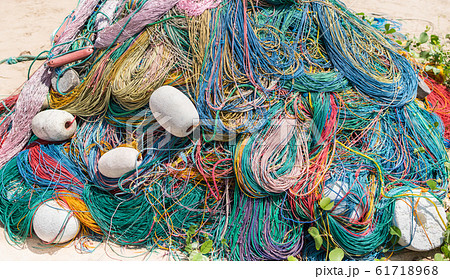 Color Fishing net, floats, nylon rope on the bank Color Fishing net, floats, nylon rope on the bank 61718968