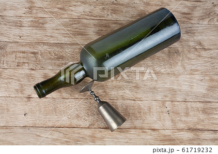 empty retro vintage green bottle with metal glass 61719232