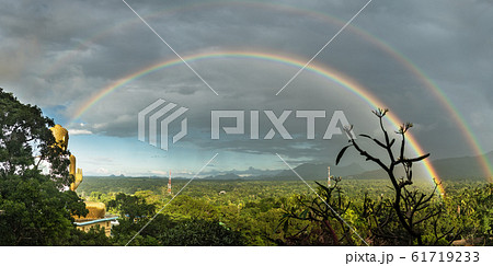 Full double rainbow and golden Buddha 61719233