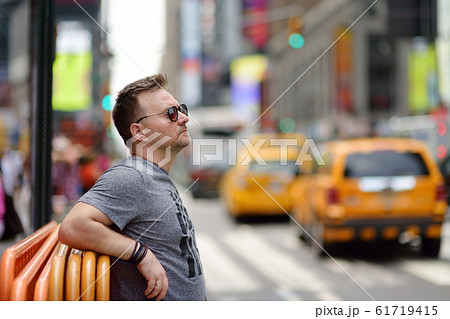 Middle age man tourist looking on Times Square Middle age man tourist looking on Times Square 61719415