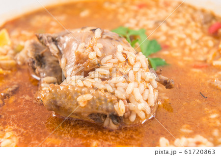 A dish of rice with partridge and artichokes 61720863