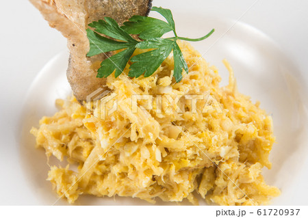 Bacalhau a Bras Tapas with fried a crispy codfish 61720937