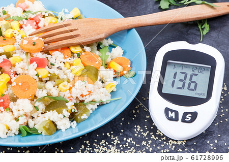 Glucose meter for checking sugar level and salad 61728996