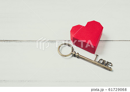 Red Paper Heart with Antique Key on white wood 61729068