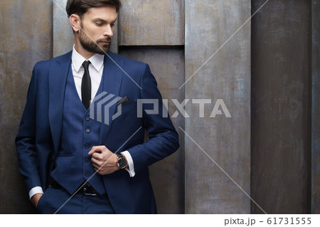 indoor photo of young handsome stylish businessman wearing suit 61731555