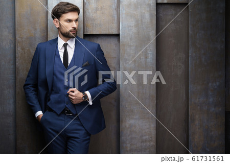 indoor photo of young handsome stylish businessman wearing suit 61731561