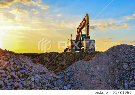 Excavator loads of stone and rubble  61731960