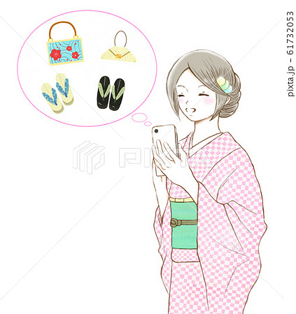 スマホを持つ着物を着た笑顔の女性_吹き出しと小物-左向き 61732053
