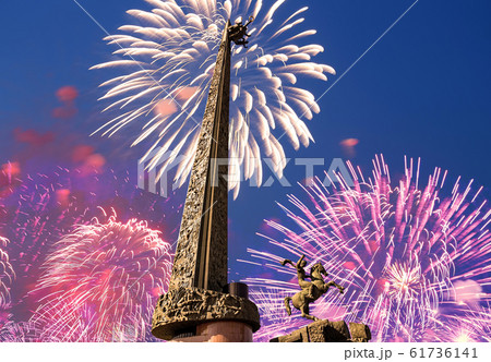 Fireworks over the War memorial in Victory Park on Poklonnaya Hill (Gora), Moscow, Russia. Fireworks over the War memorial in Victory Park on Poklonnaya Hill (Gora), Moscow, Russia. 61736141