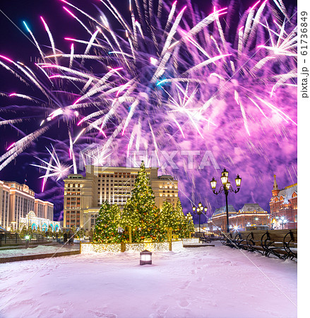 Fireworks over the Christmas and New Year holidays illumination and Manege Square at night. Moscow, Russia 61736849